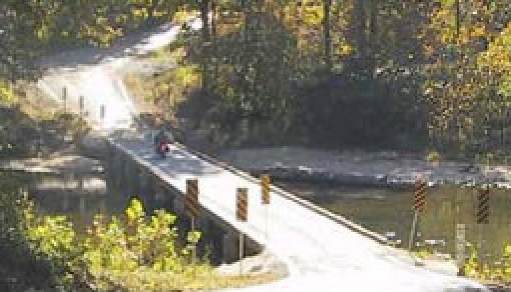 The gravel road and old wooden bridge at Patrick featured