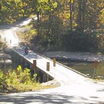 The gravel road and old wooden bridge at Patrick1