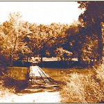 The gravel road and old wooden bridge at Patrick